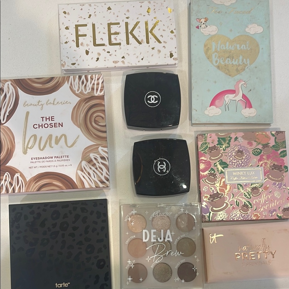 box of barely used neutral eye palettes including 2 Chanel,Tarte and Winky Lux